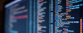 Computer screen displaying code and data visualizations, representing a new tech breakthrough.
